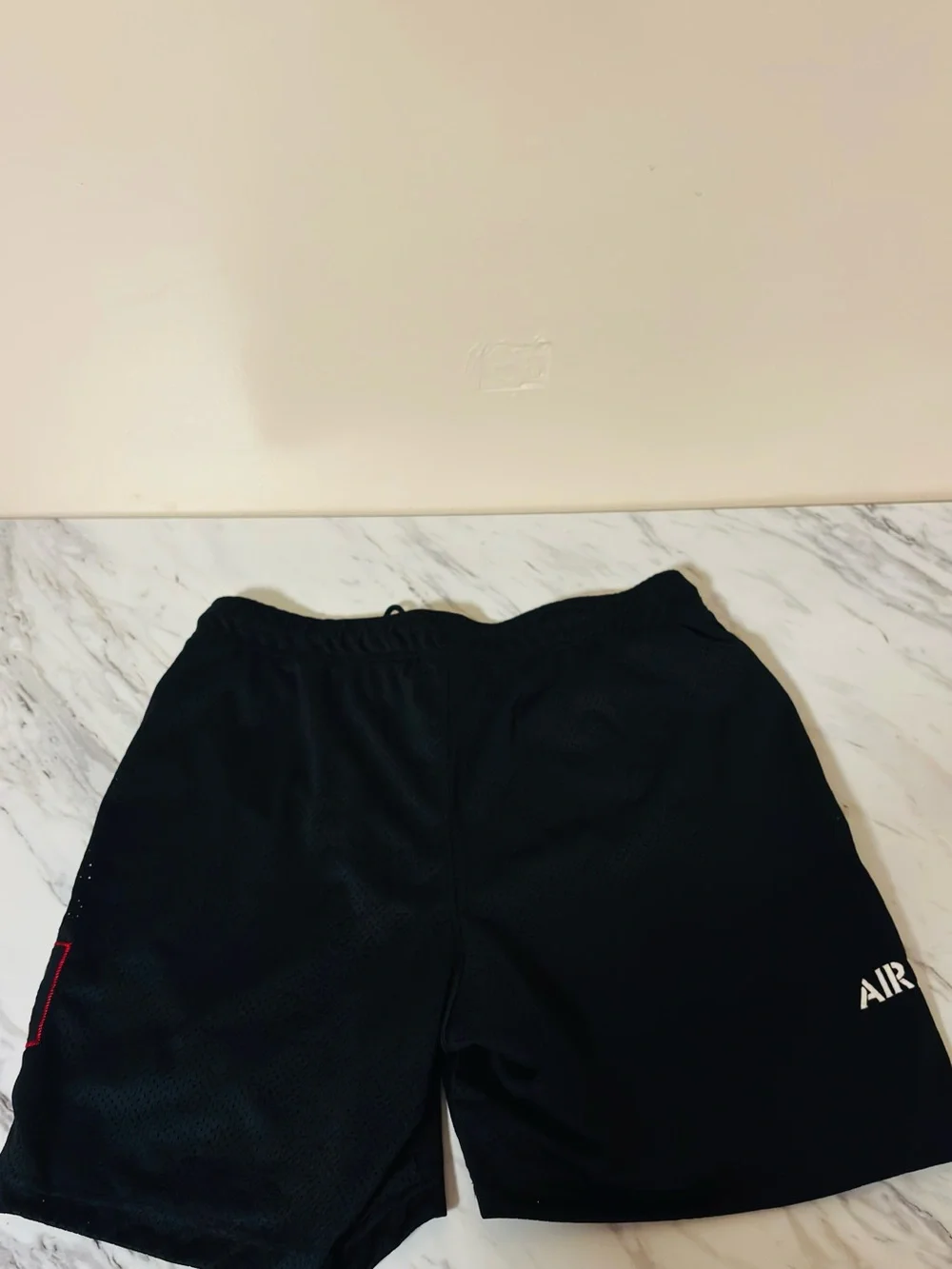 Jordan Black Athletic Mesh Shorts with Red Logo Accent